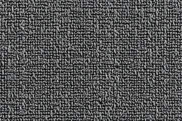 Seamless monochrome textile texture; intricate woven pattern, ideal for design projects.