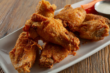 A view of a plate of cajun dry rub hot wings. 