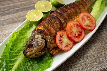 A view of a plate of fish tibs, featuring trout.