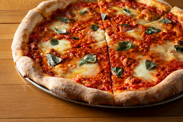 A view of a rustic red sauce pizza.