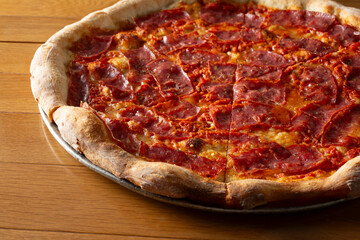 A view of a salami pizza.