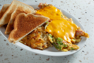 A view of a Denver omelet breakfast plate.