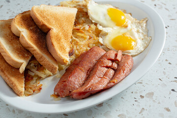 A view of a polish sausage and egg breakfast plate.