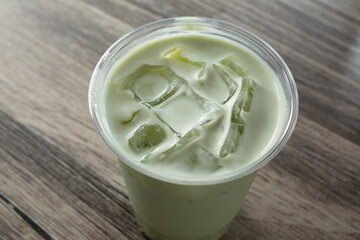 A closeup view of an iced matcha latte.