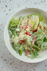 A top down view of a modern Caesar salad.