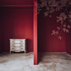 Elegant Antique White Chest of Drawers in a Red Room with Leaf Design Accent Wall