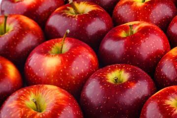 close up shot of a group of many freshness red apples with some yellow color marks