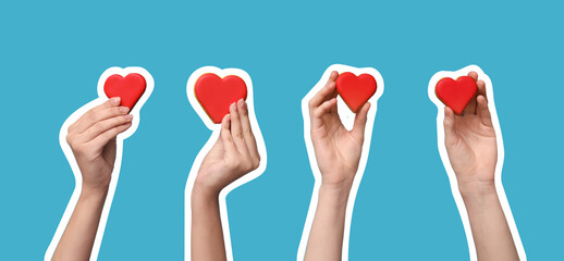 Women with heart-shaped cookies on blue background. Valentine's Day celebration