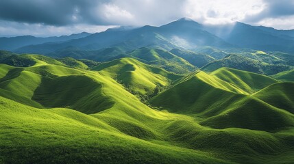 Lush green hills under dramatic skies showcasing a stunning mountain range and vibrant landscape scenery