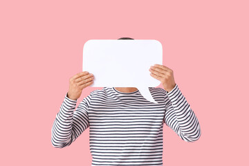 Mature man with blank speech bubble on pink background