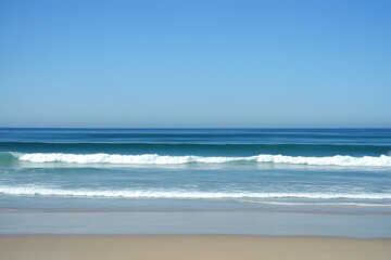 Naklejka premium Tranquil blue ocean extending to the horizon with gentle waves and a clear sky