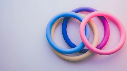 Fototapeta premium Intertwined pastel hoops in blue pink and purple