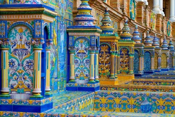 Colorful ceramic tiles and ornate columns at Plaza de Espana in Seville.