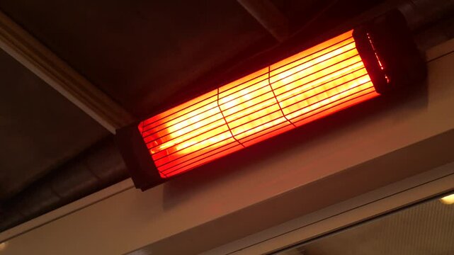 Modern electric infrared heater on celling 