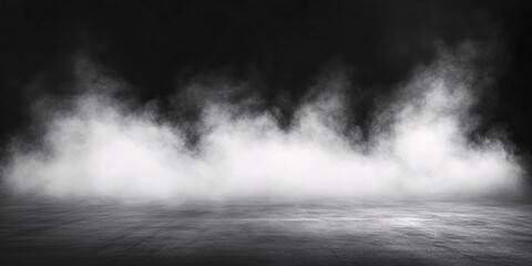 Dramatic black and white image of thick fog or smoke over a dark ground.