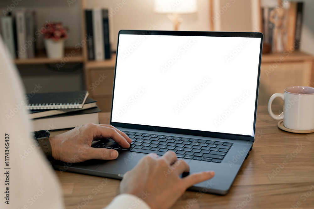 Aufkleber close-up image of a man working on laptop computer at a table, typing on the laptop keyboard. the la