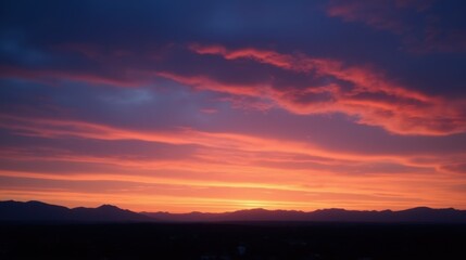 Fototapeta premium Majestic Sunset Over Mountains with Vibrant Sky and Cloud Patterns