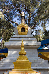 Statue of Buddha along with one of the stupa in Buddha Park, Swayambhunath, Kathmandu, Nepal