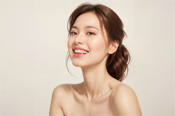 A woman with a smile on her face and her hair in a bun