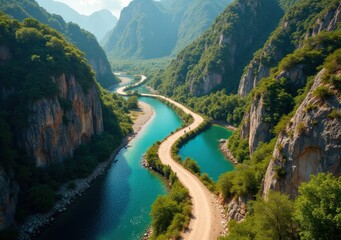 Scenic view of winding river surrounded by lush mountains and clear blue sky