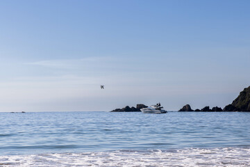 Panorama of the beach in Jalisco, Mexico with waves caused by the tide with islands in the background