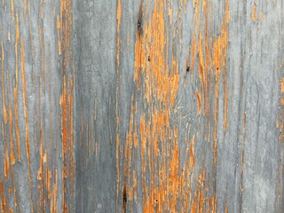 Peeling paint on a wooden surface close-up