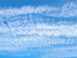 Obraz premium Beautiful view of fluffy white clouds in the blue sky. Natural background