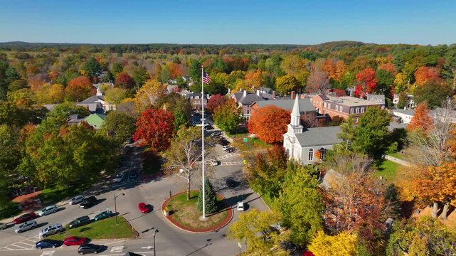 Concord Monument Square aerial view including Holy Family Parish Church and Concord Town Hall in fall with foliage in town center of Concord, Massachusetts MA, USA. 