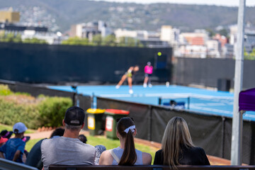 crowds watching a tennis match. Crowd watching a sporting match.