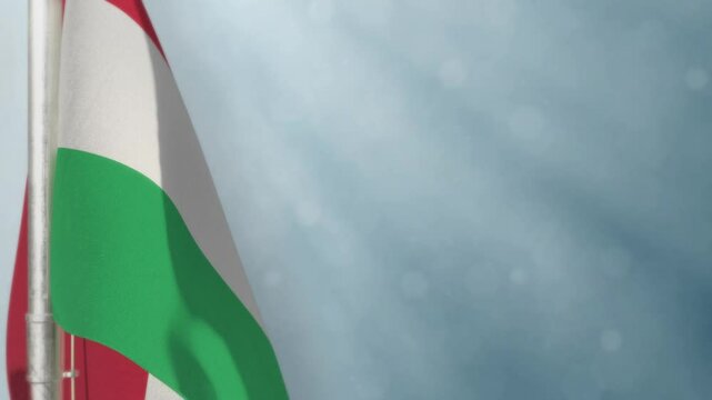 Waving Hungary flag on light blue bokeh background