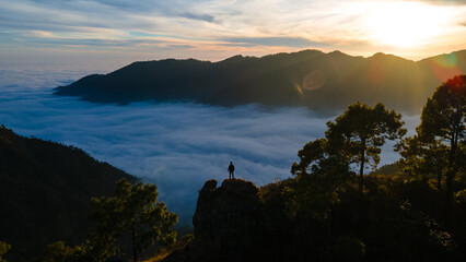 silhouette of a person in the mountains