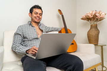 Musician enjoying a relaxed guitar session at home, surrounded by modern decor and a cozy atmosphere