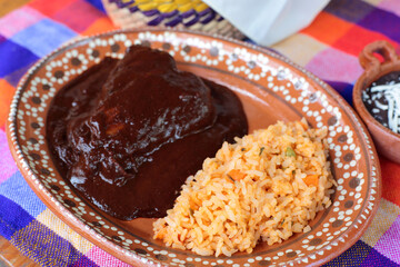 Typical mexican meal of chicken and mole with rice