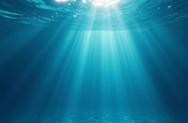 Underwater scene showing sunbeams filtering through water surface creating beautiful light rays