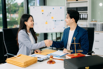 Woman lawyer hand and women client shaking hand collaborate on working agreements