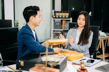  Lawyer refusing bribe money in the envelop from business man at the lawyer office.