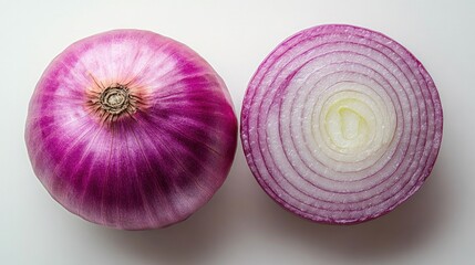 Whole and halved red onion on white background.