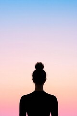 Silhouette of Woman Meditating at Sunrise Easter, New Year, and Thanksgiving Harmony