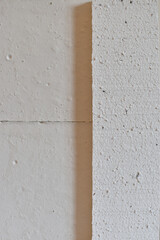 Close view of a gypsum casting highlighting its texture and seam