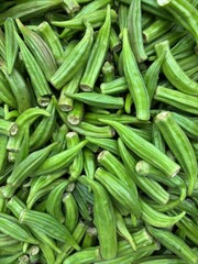 Closeup on bright green okra at grocery store