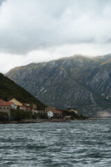 Fototapeta premium Rugged slopes and calm bay at golden hour