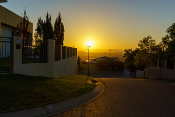 Looking Down a street with a view at sunset