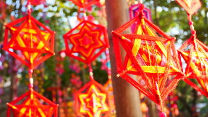 A hanging ornament resembling a spider web from the Karen tribe in Thailand, believed to be a...