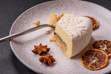 Piece of cheesecake with nuts and berries with winter pattern