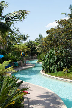 Winding lazy river swimming pool at water park