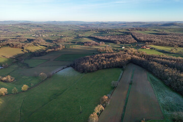Naklejka premium Aerial view of Burgundy, France, with fields, forests and hills in winter