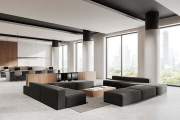 Modern office interior with open space concept, featuring a cozy lounge area, workstations, and large windows overlooking city view. 3D Rendering