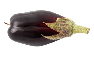 A purple pepper with a green stem
