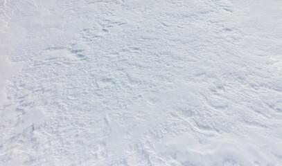 A snow covered ground with no visible objects