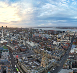 High Angle Ultra Wide High Resolution Panoramic View of Historical Liverpool City of England During Orange Sunrise Moring Time. Drone's Camera Footage on November 11th, 2024 from Medium High Altitude